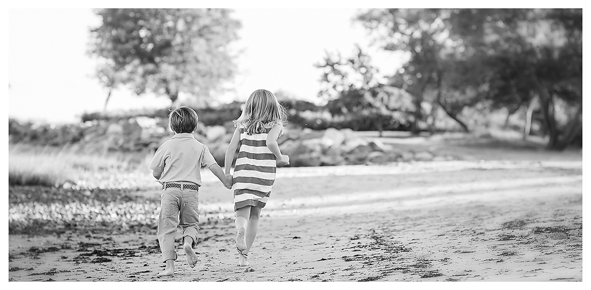 Kids running on the beach at Tod's Point in Greenwich, by top CT Family Photographer Kelli Dease