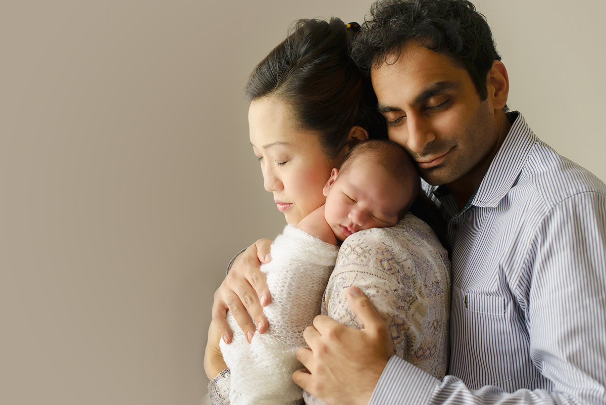 Greenwich CT top newborn photographer. Mother, father and newborn baby.