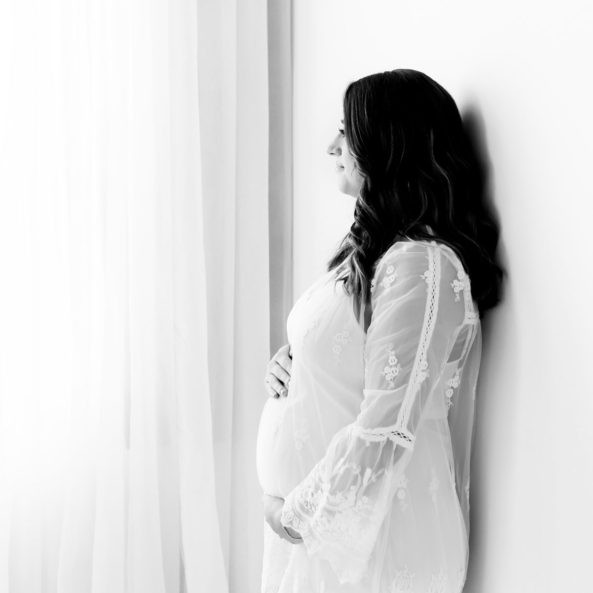 2024 Maternity Portfolio CT Photographer 1200px_18 Studio maternity photoshoot featuring a mom in a white dress with floral details in a light and airy style
