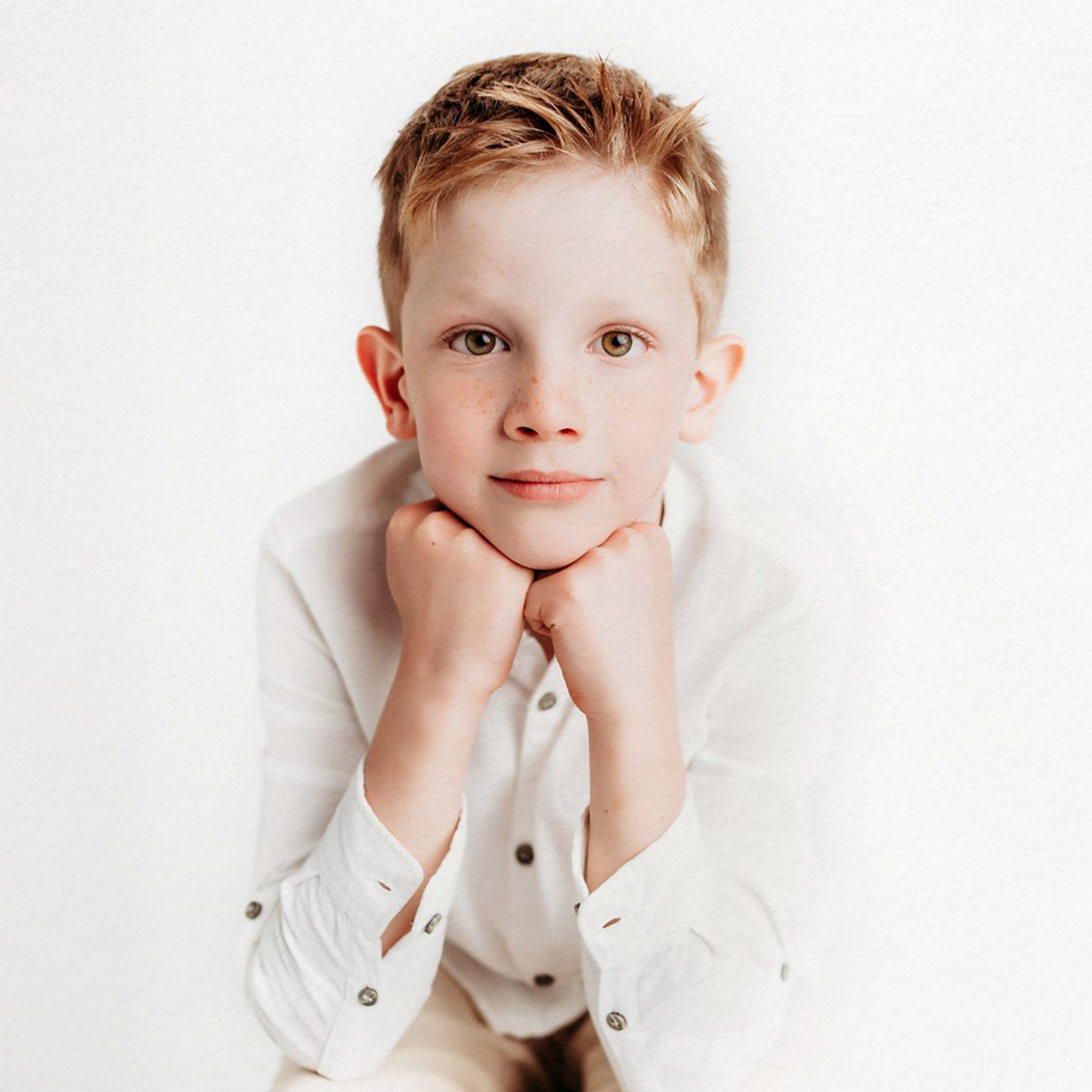 Farmington, CT children's personality portrait session. Minimalistic, light-filled studio portraits that highlight authentic expressions and childhood joy. Perfect for parents looking for timeless, personality-driven photography in Connecticut.