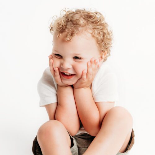 Farmington, CT children's personality portrait session. Minimalistic, light-filled studio portraits that highlight authentic expressions and childhood joy. Perfect for parents looking for timeless, personality-driven photography in Connecticut.