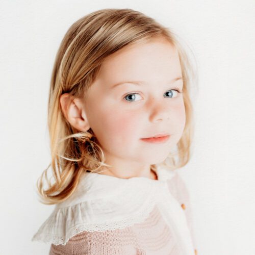 Farmington, CT children's personality portrait session. Minimalistic, light-filled studio portraits that highlight authentic expressions and childhood joy. Perfect for parents looking for timeless, personality-driven photography in Connecticut.