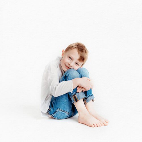 Farmington, CT children's personality portrait session. Minimalistic, light-filled studio portraits that highlight authentic expressions and childhood joy. Perfect for parents looking for timeless, personality-driven photography in Connecticut.