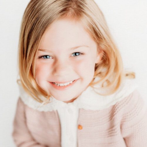 Farmington, CT children's personality portrait session. Minimalistic, light-filled studio portraits that highlight authentic expressions and childhood joy. Perfect for parents looking for timeless, personality-driven photography in Connecticut.