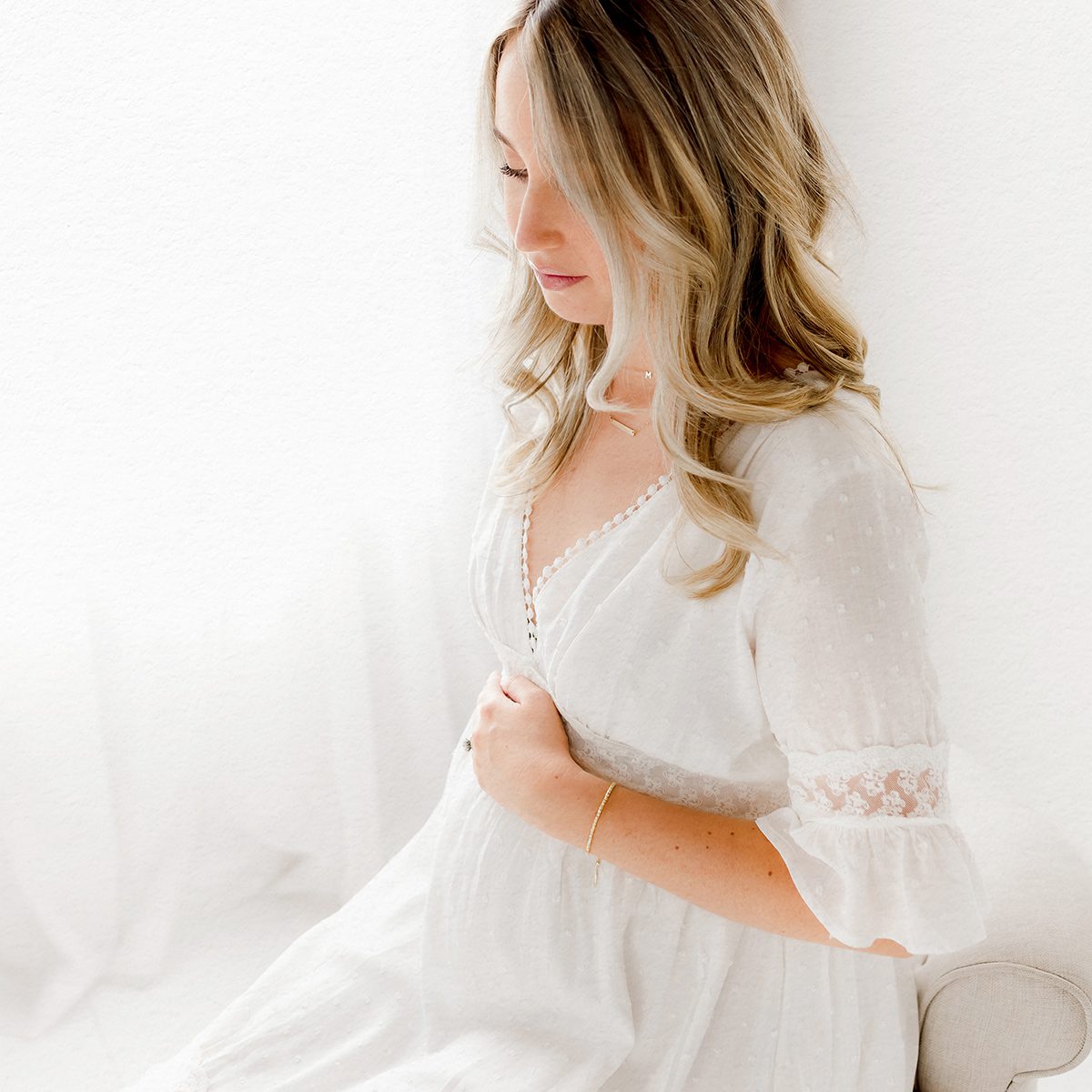 2025 Maternity Portfolio CT Photographer 1200px_06 Maternity photo of mom holding bump in Connecticut photography studio in a light and airy style