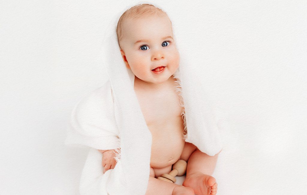 Minimalistic, light-filled studio baby portrait. Portraits for parents looking for timeless, baby-driven photography in Connecticut.