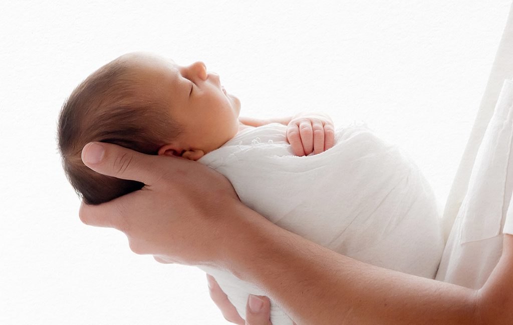 Minimalistic, light-filled studio newborn portrait. Portraits for parents looking for timeless, baby-driven photography in Connecticut.