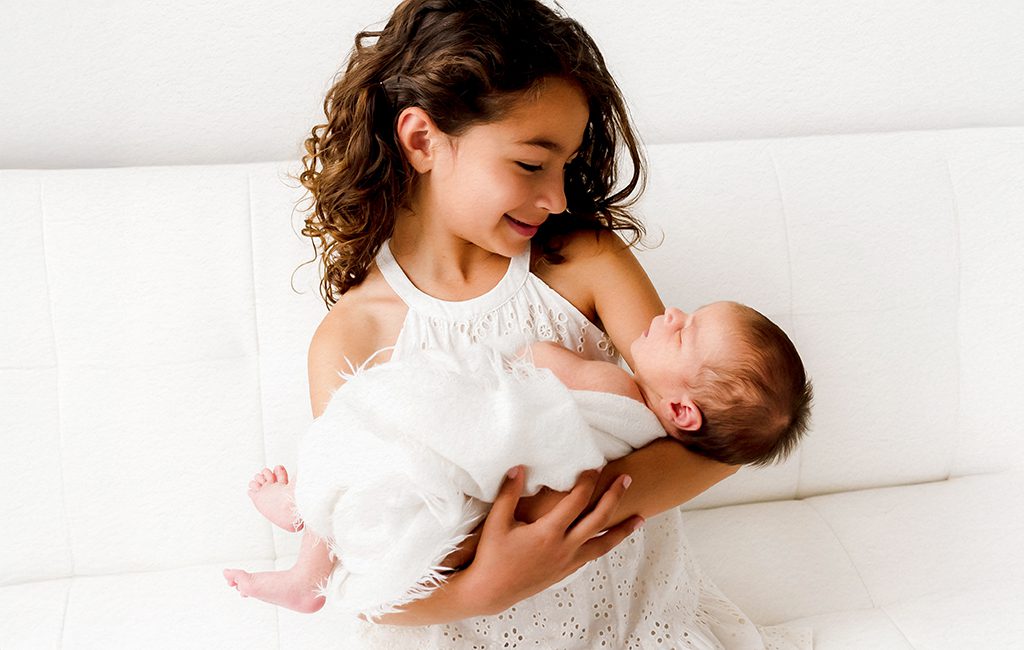 Minimalistic, light-filled studio newborn portrait. Portraits for parents looking for timeless newborn and sibling photography in Connecticut.