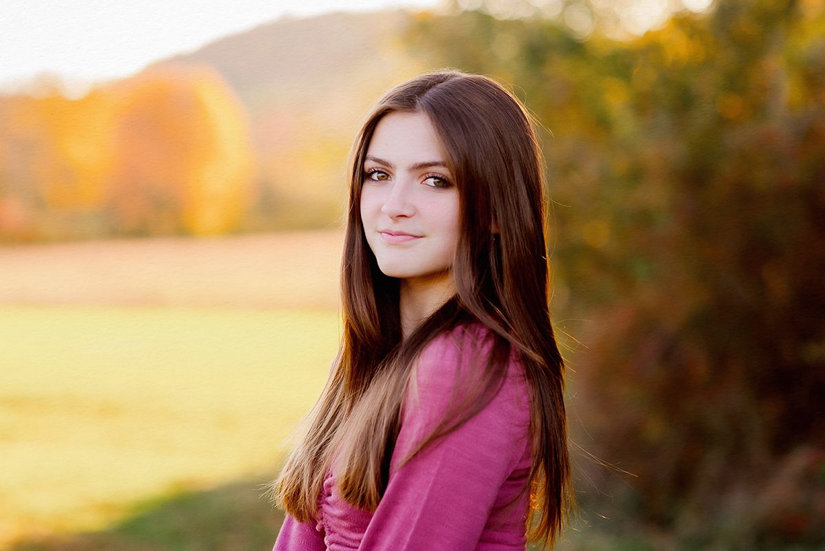 Teen girl outdoor fall portrait in Connecticut with soft natural light and seasonal outfit inspiration.