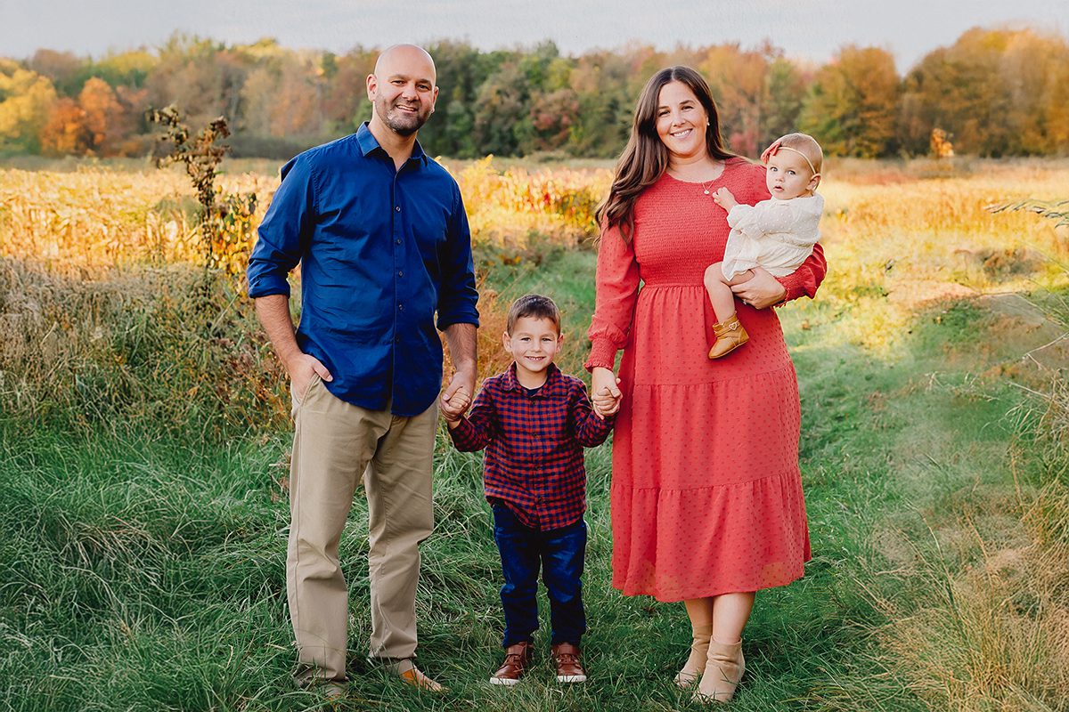 Crimson dress and warm fall outfits for family photos near West Hartford CT in early autumn.