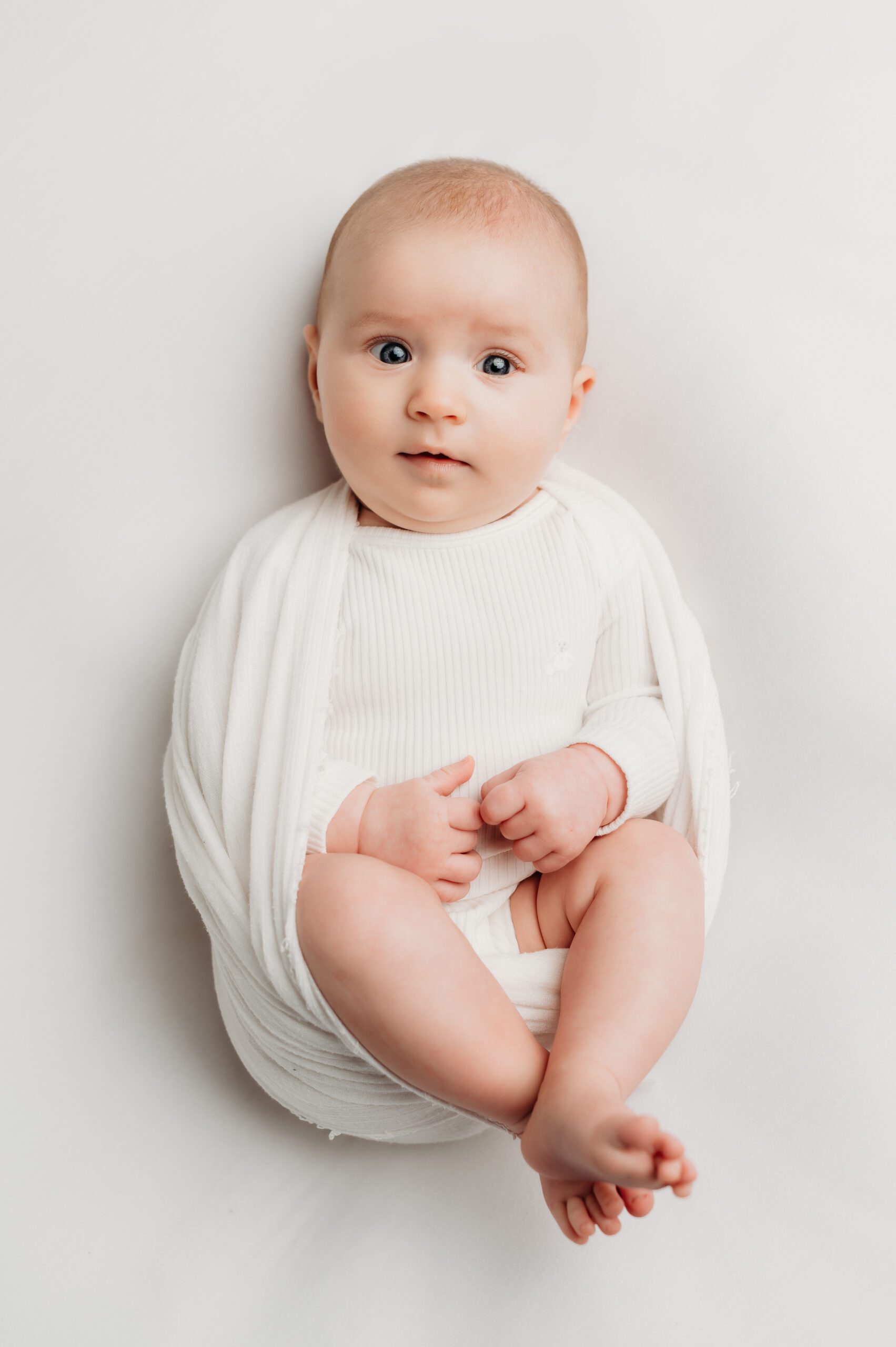 Six-week-old baby photographed during a studio newborn session with Connecticut newborn photographer Kelli Dease