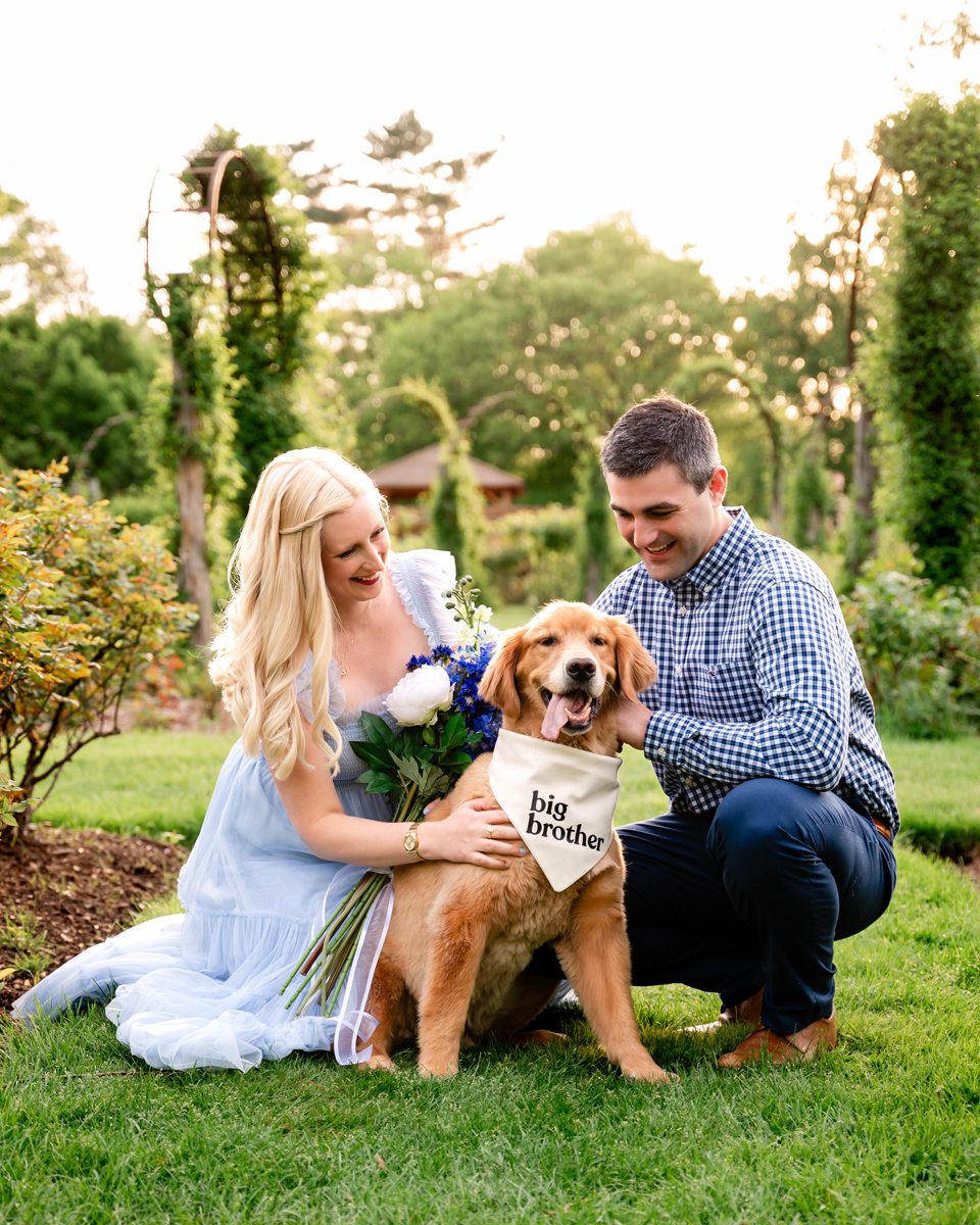 Expecting couple with their dog during a maternity session in the rose garden at Elizabeth Park in West Hartford