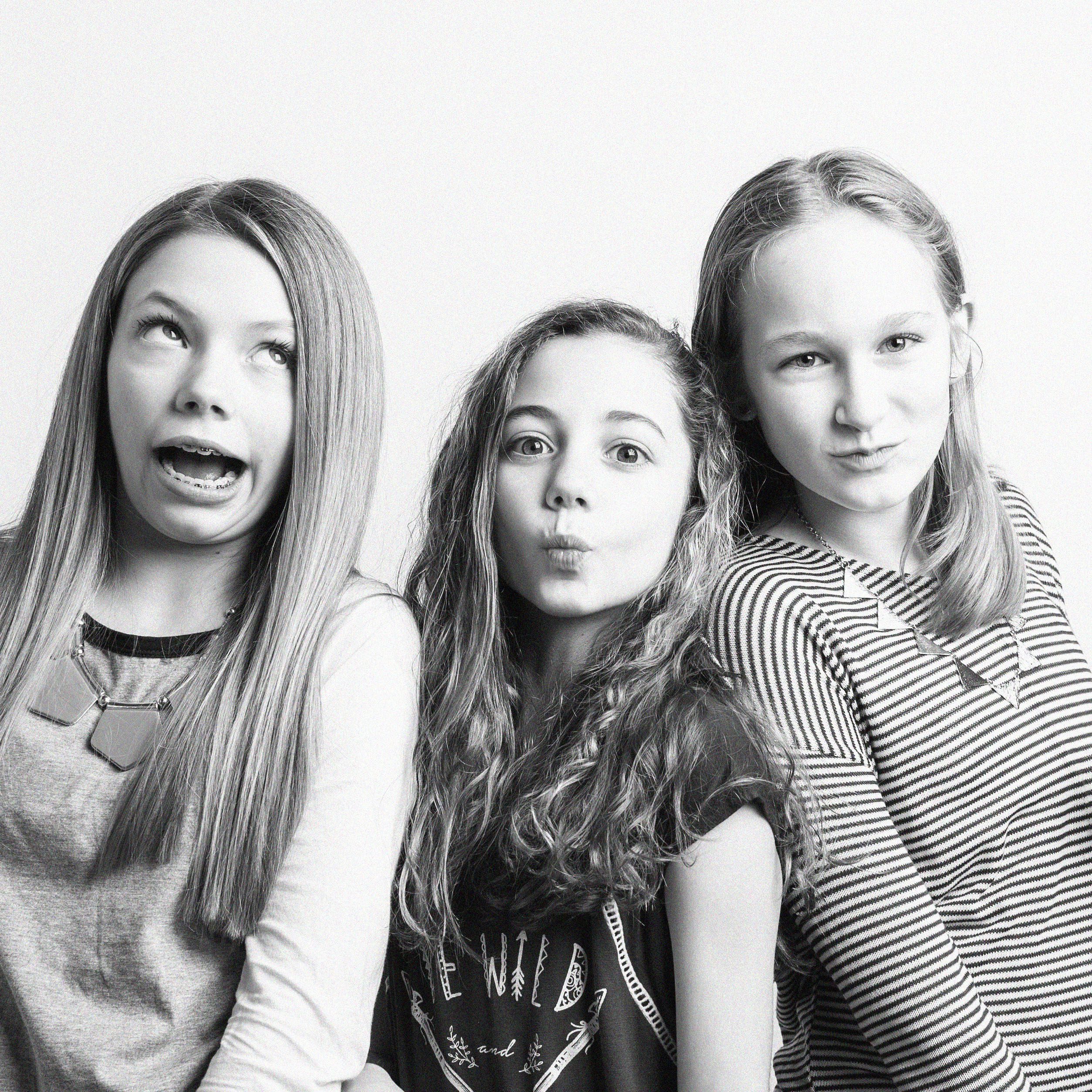 KDP_7082 BW SQ_WEB Three preteen girls making silly faces together in black and white photo during birthday portrait session at Kelli Dease Photography, Farmington CT